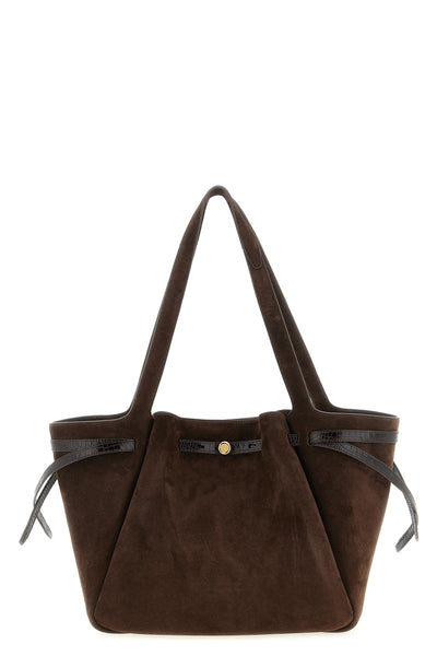 the tory burch romy tote bag embodies structured elegance through a clever pla