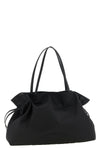 the tory burch ella drawstring shoulder bag redefines everyday volumes through