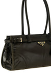 the prada bonnie midi handbag stands out for its elongated rectangular silhoue