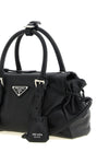 the small prada karin handbag in fine black hammered calf leather is distingui