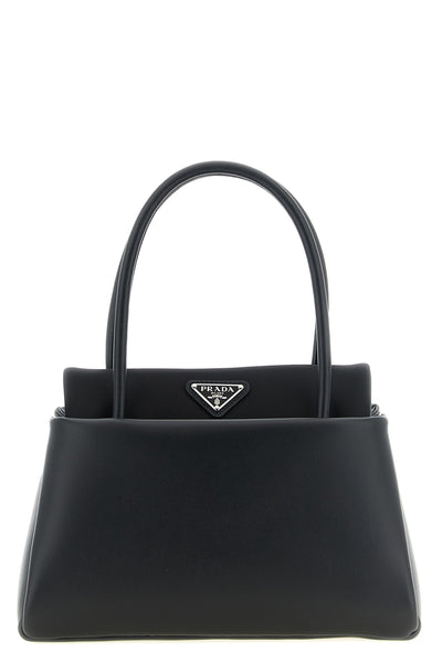 the prada passage small handbag defines a new geometry of luxury through an ar
