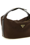 the prada chérie mini handbag redefines the codes of contemporary luxury throu
