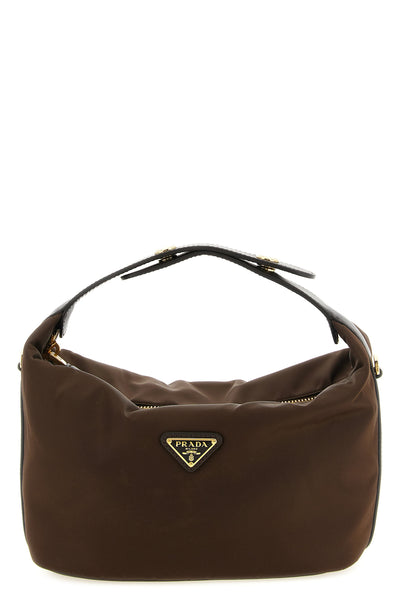 the prada chérie mini handbag redefines the codes of contemporary luxury throu