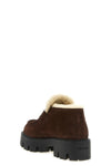 prada loafers redefine the classic silhouette through contemporary volumes and c