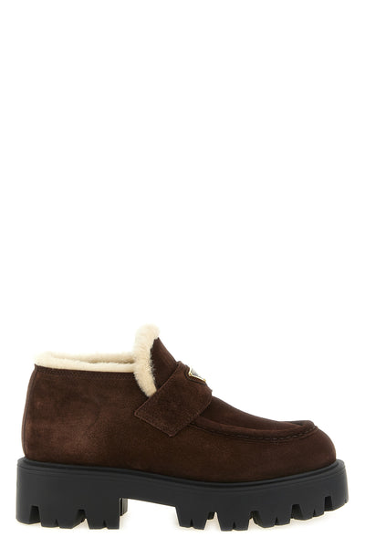 prada loafers redefine the classic silhouette through contemporary volumes and c