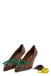 prada pumps redefine classic femininity through a bold contrast between sartoria