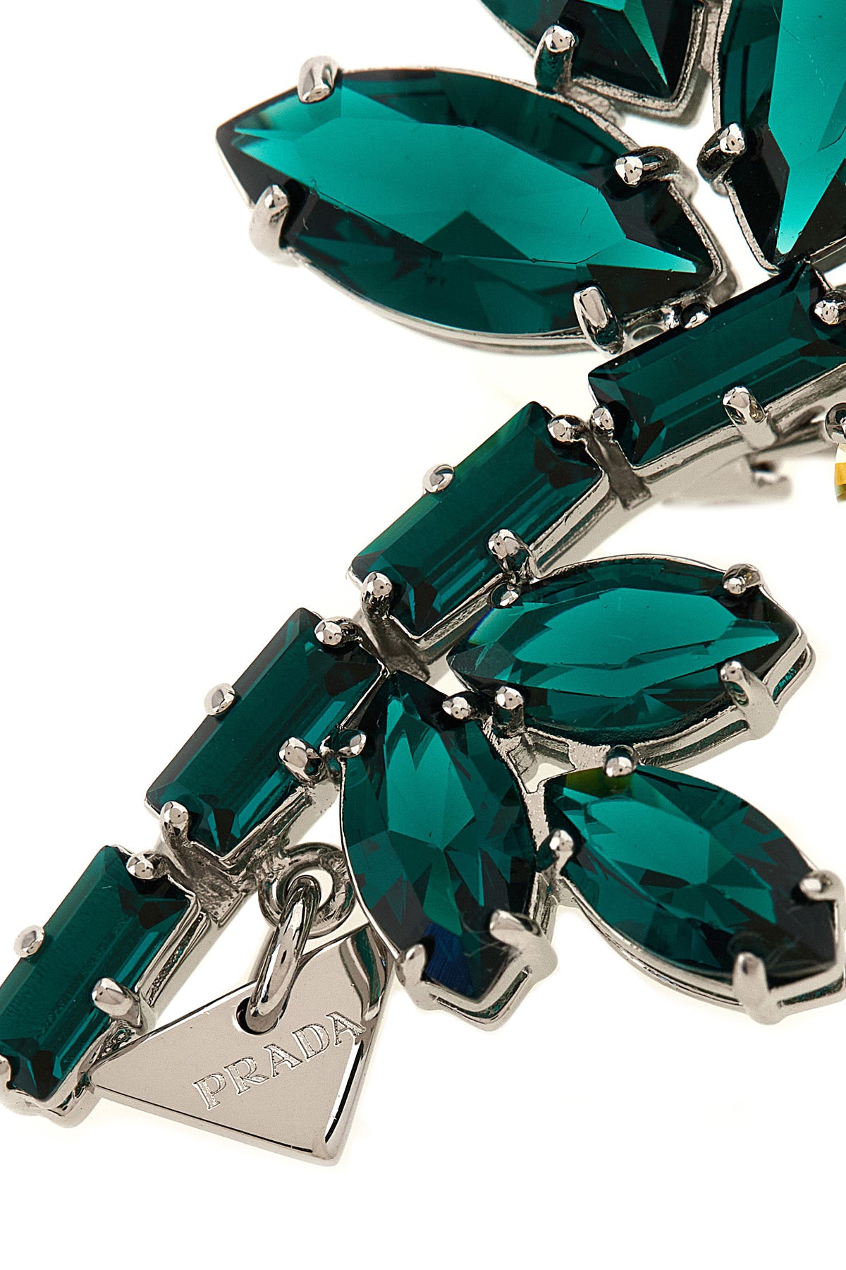 the prada crystal flowers brooch defines the brands aesthetic through a rigorou