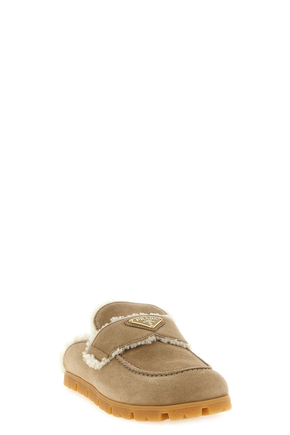 the prada sabot in soft calf suede redefines the concept of slip-on footwear thr