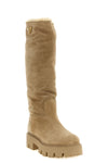prada high boots redefine winter proportions through a structured silhouette