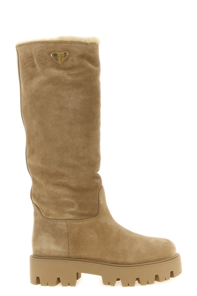 prada high boots redefine winter proportions through a structured silhouette