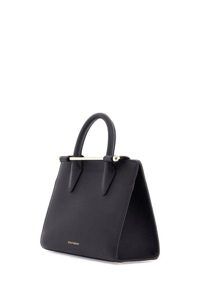 mini tote structured in black leather with gold details