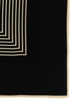 the toteme centered monogram scarf redefines everyday elegance through versati