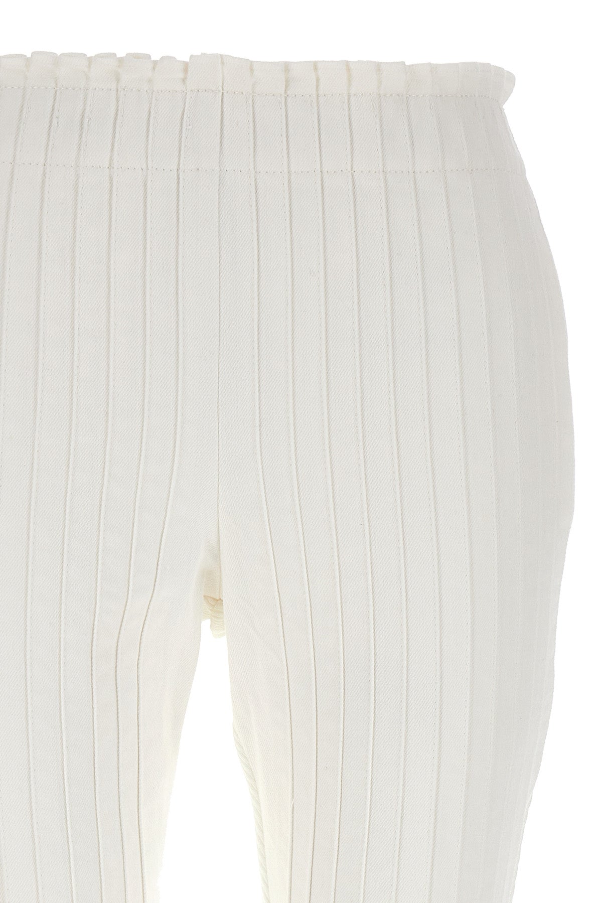 pleated cotton pants at the front and ribbed pants at the back