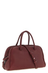 the jacquemus le petit turismo handbag reinterprets the classic bowling silhou
