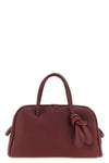 the jacquemus le petit turismo handbag reinterprets the classic bowling silhou