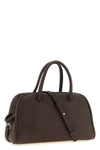 the jacquemus le petit turismo handbag reinterprets the classic bowling silhou