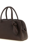 the jacquemus le petit turismo handbag reinterprets the classic bowling silhou