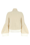 the sacai wool knit blouson exemplifies the brands distinctive hybrid construct
