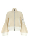 the sacai wool knit blouson exemplifies the brands distinctive hybrid construct