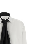 the sacai shirt redefines the codes of classic tailoring through a hybrid and de