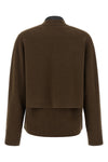 the sacai cardigan redefines knitwear codes through the brands unmistakable dec