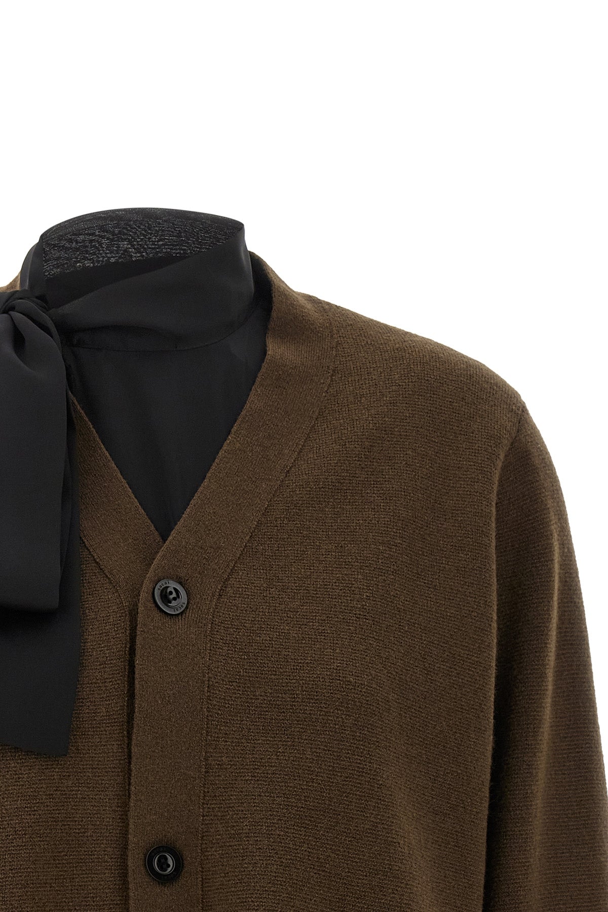 the sacai cardigan redefines knitwear codes through the brands unmistakable dec