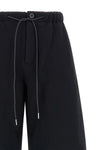 the sacai pants in pure cotton jersey redefine the codes of casual dress through