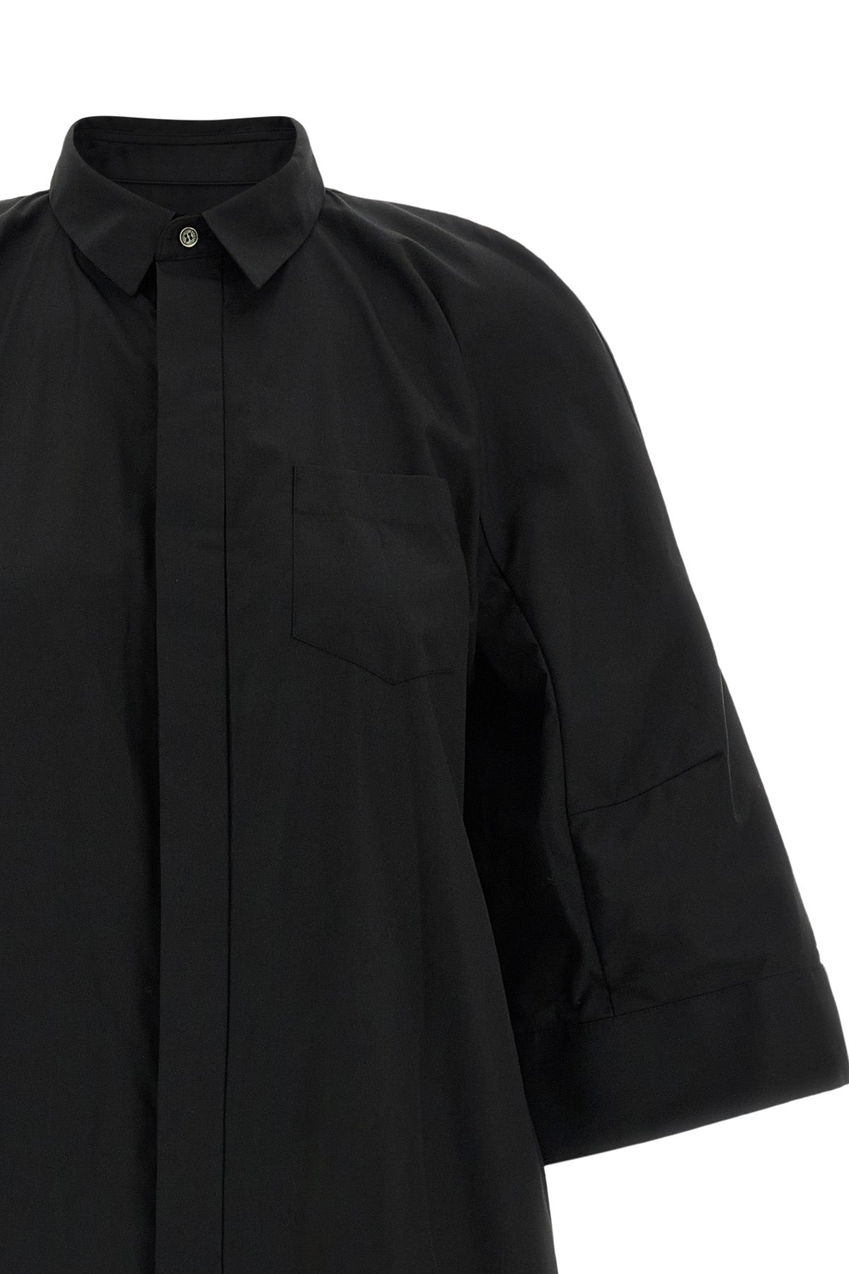 the sacai shirt dress redefines the codes of contemporary tailoring through unex