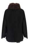 the sacai black jacket redefines the codes of outerwear through a complex hybrid