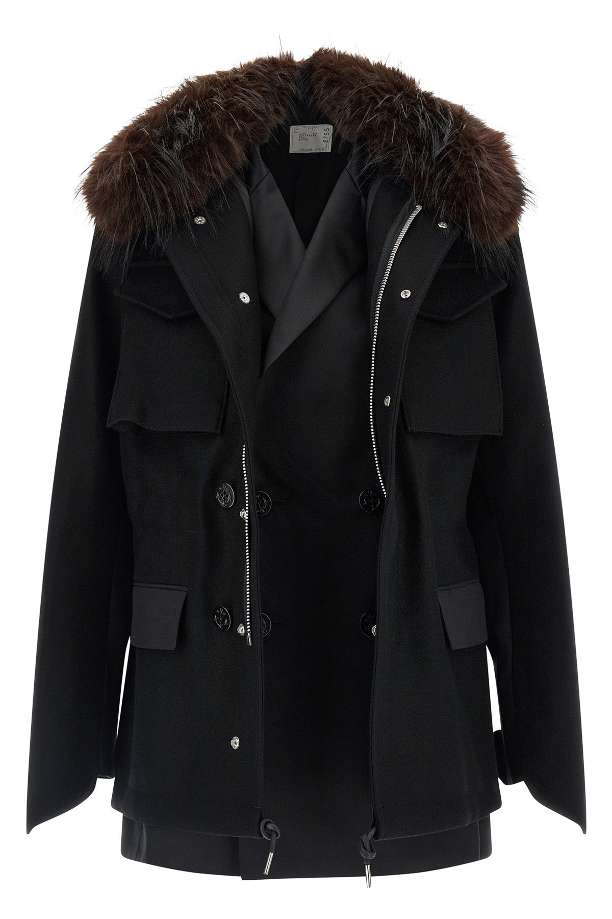 the sacai black jacket redefines the codes of outerwear through a complex hybrid
