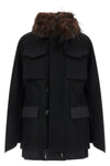 the sacai black jacket redefines the codes of outerwear through a complex hybrid