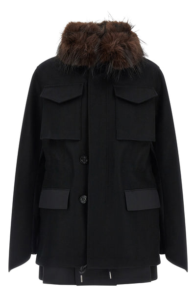 the sacai black jacket redefines the codes of outerwear through a complex hybrid