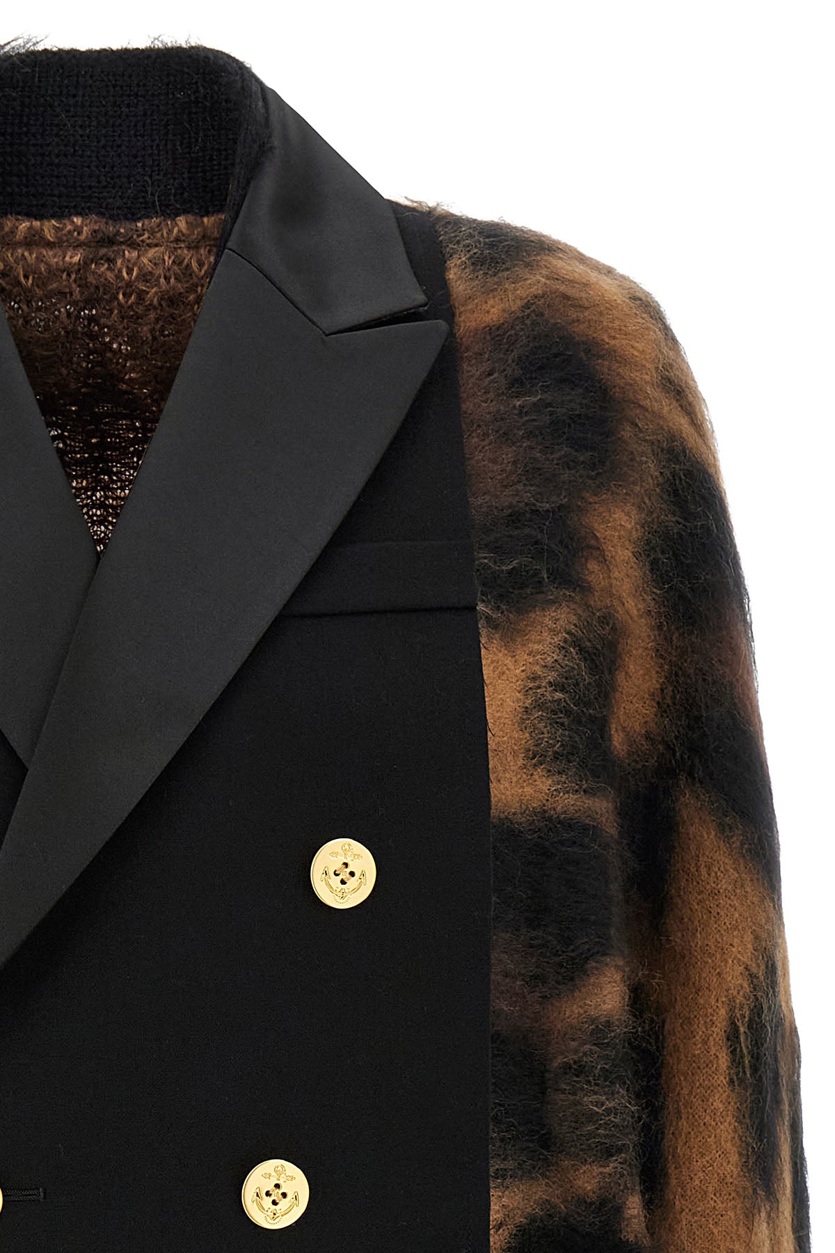 the sacai cardigan redefines knitwear codes through a complex hybrid constructio