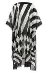 the caftan dries van noten presents a study on fluid volumes and sharp graphic c
