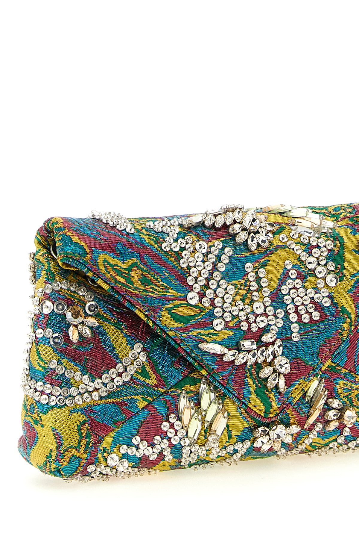 the dries van noten clutch defines the codes of the evening through a rigorous e
