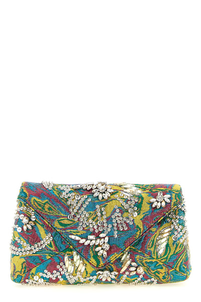 the dries van noten clutch defines the codes of the evening through a rigorous e