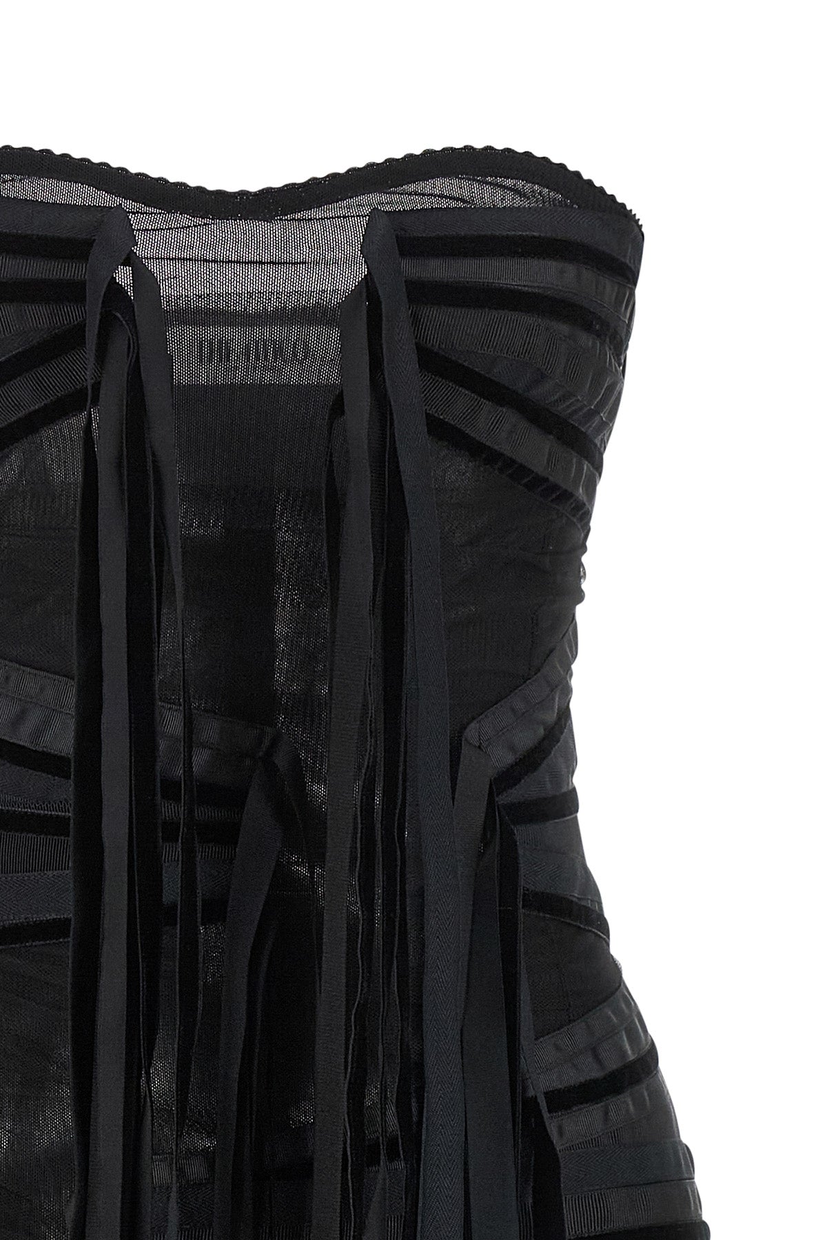 the attico mini dress redefines the evening silhouette through a bold play of tr