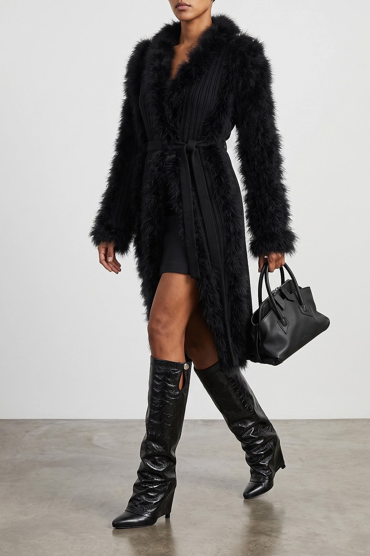 the attico long coat redefines the codes of knitwear through scenographic volume
