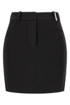 the attico mini skirt defines a sculptural and decisive silhouette through rigor