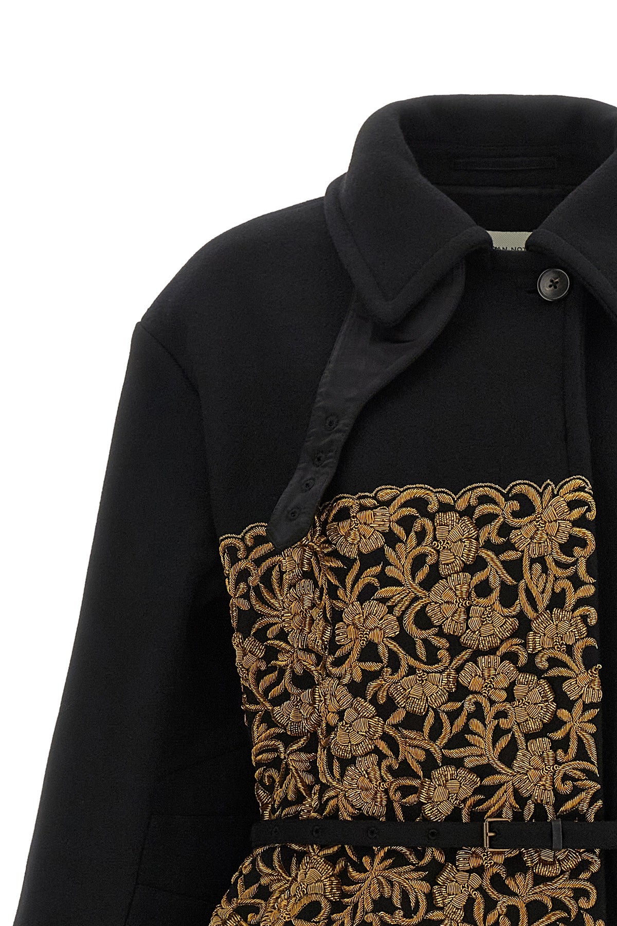 the dries van noten rain coat redefines the codes of outerwear through an aest