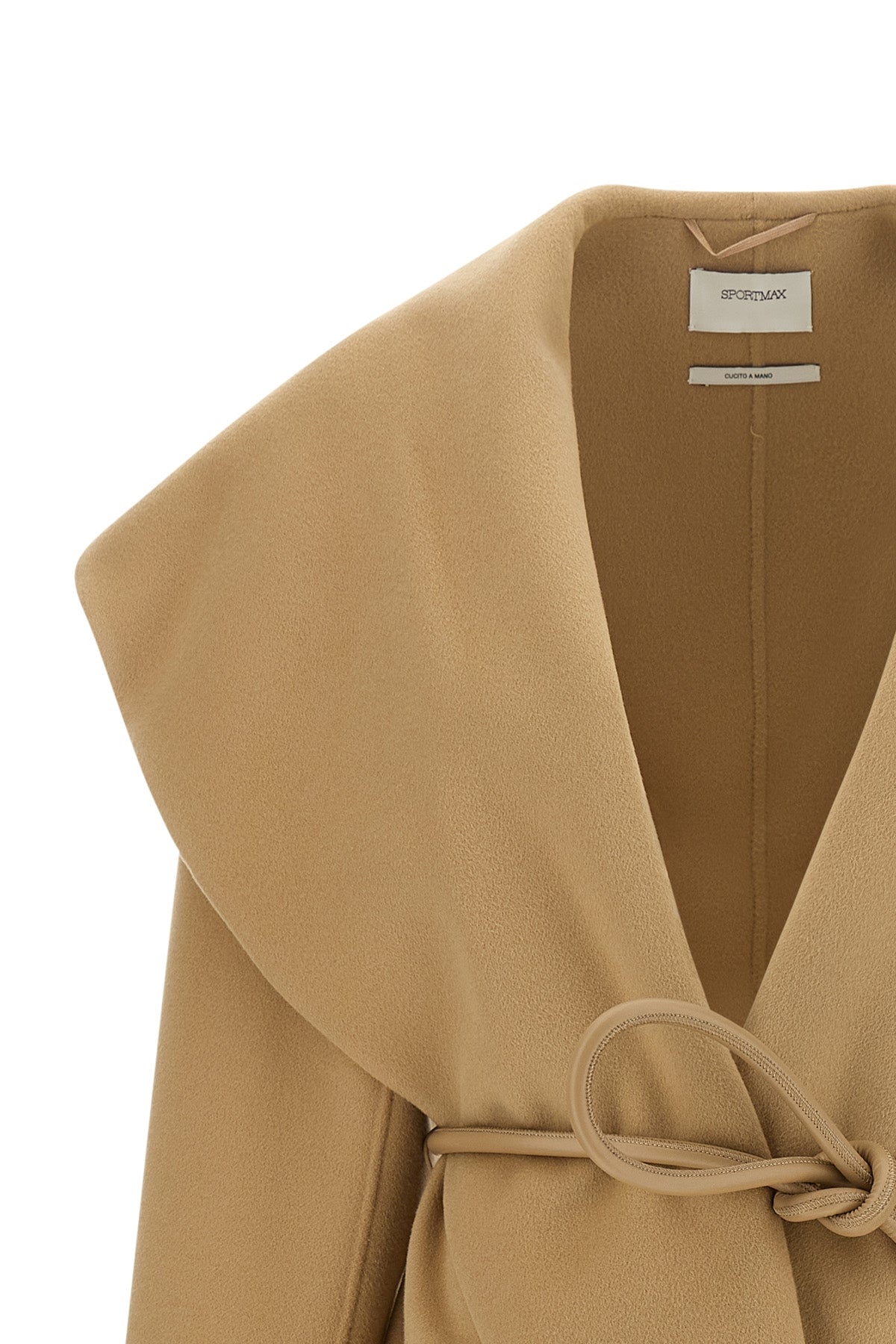 the sportmax spxuguale jacket redefines the volumes of outerwear through a rig