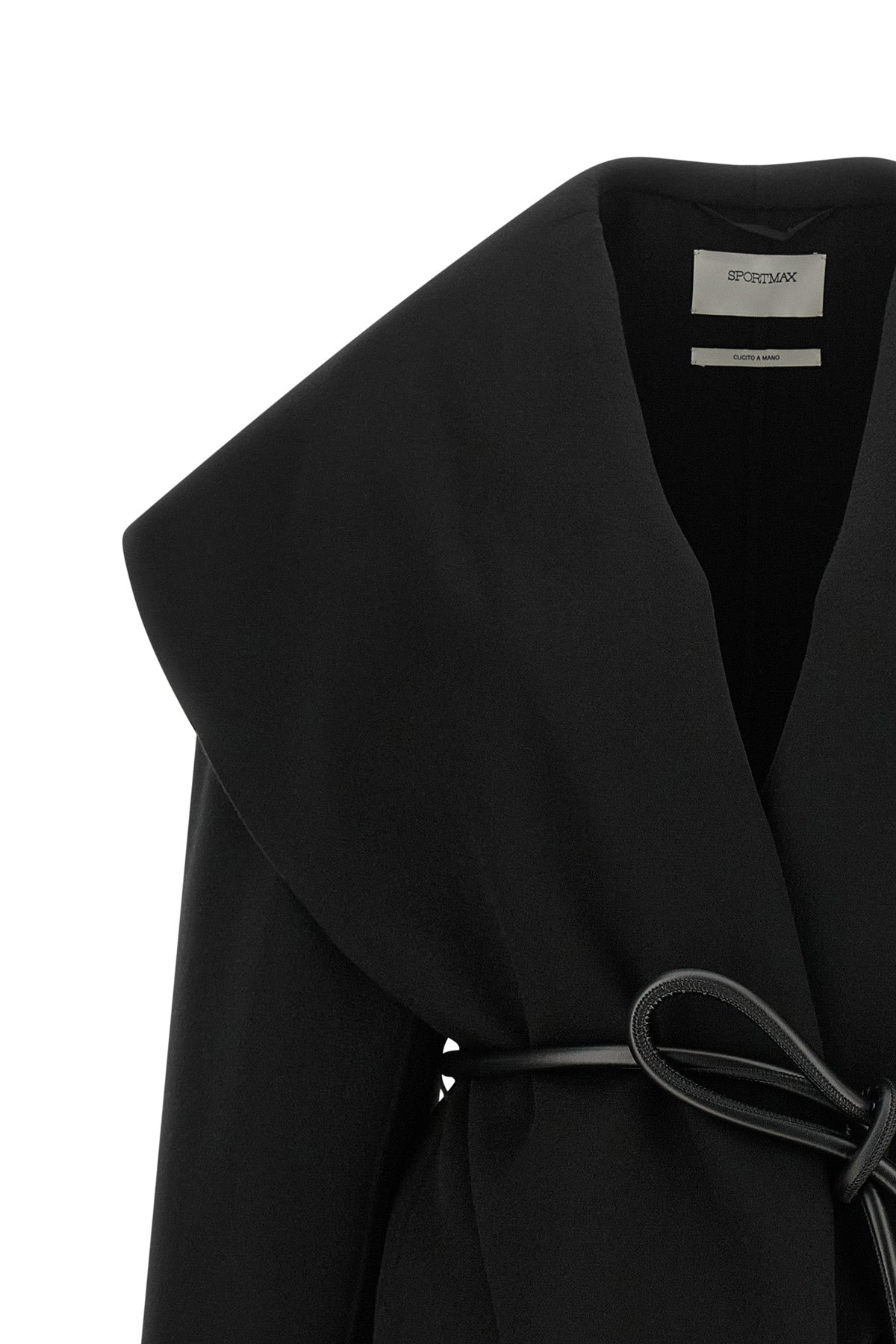 the sportmax spxuguale jacket redefines the volumes of outerwear through a rig