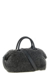 the max mara teddy holdals small handbag stands out for its voluminous and env