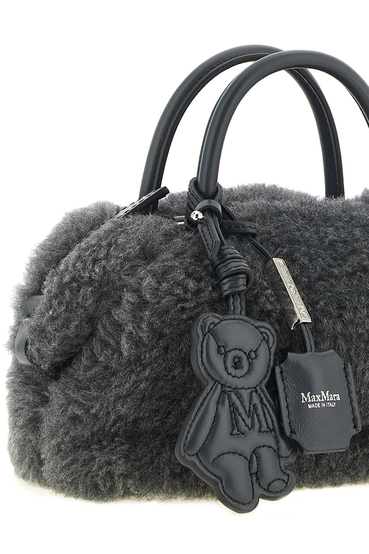 the max mara teddy holdals small handbag stands out for its voluminous and env