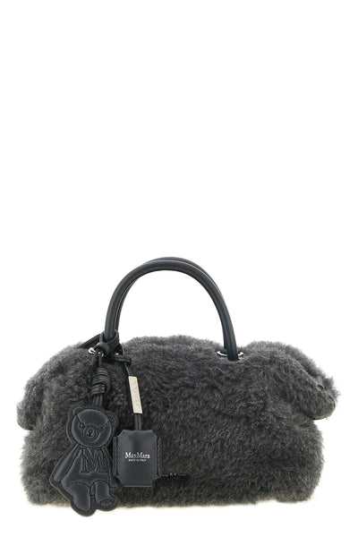 the max mara teddy holdals small handbag stands out for its voluminous and env