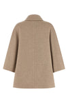 the max mara ospite cape redefines the volumes of outerwear through a flared sil