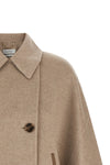 the max mara ospite cape redefines the volumes of outerwear through a flared sil