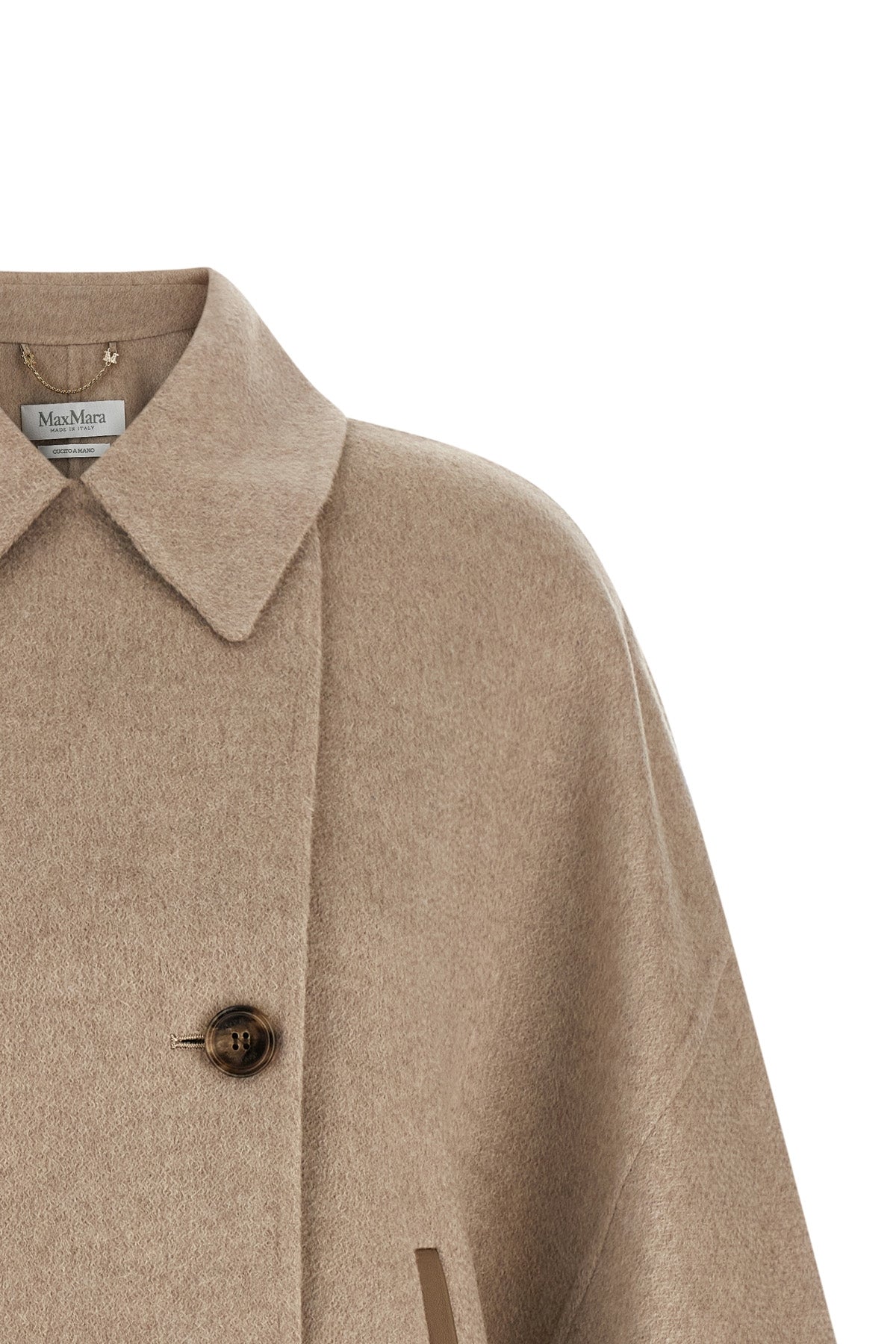 the max mara ospite cape redefines the volumes of outerwear through a flared sil