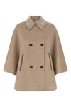 the max mara ospite cape redefines the volumes of outerwear through a flared sil