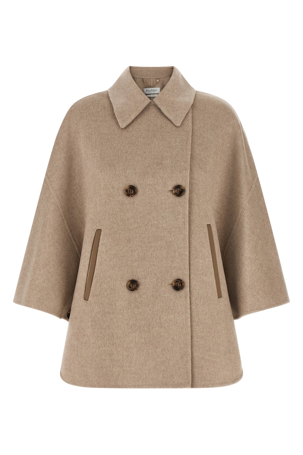 the max mara ospite cape redefines the volumes of outerwear through a flared sil